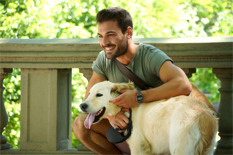 A pet owner with a dog in a fundraising event.