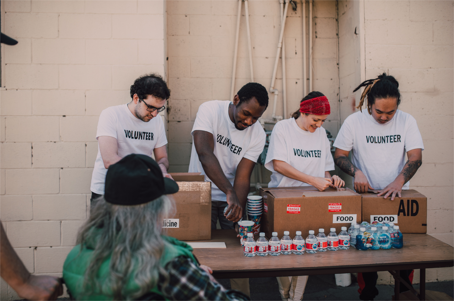 A volunteer team is preparing and organizing a fundraising event.