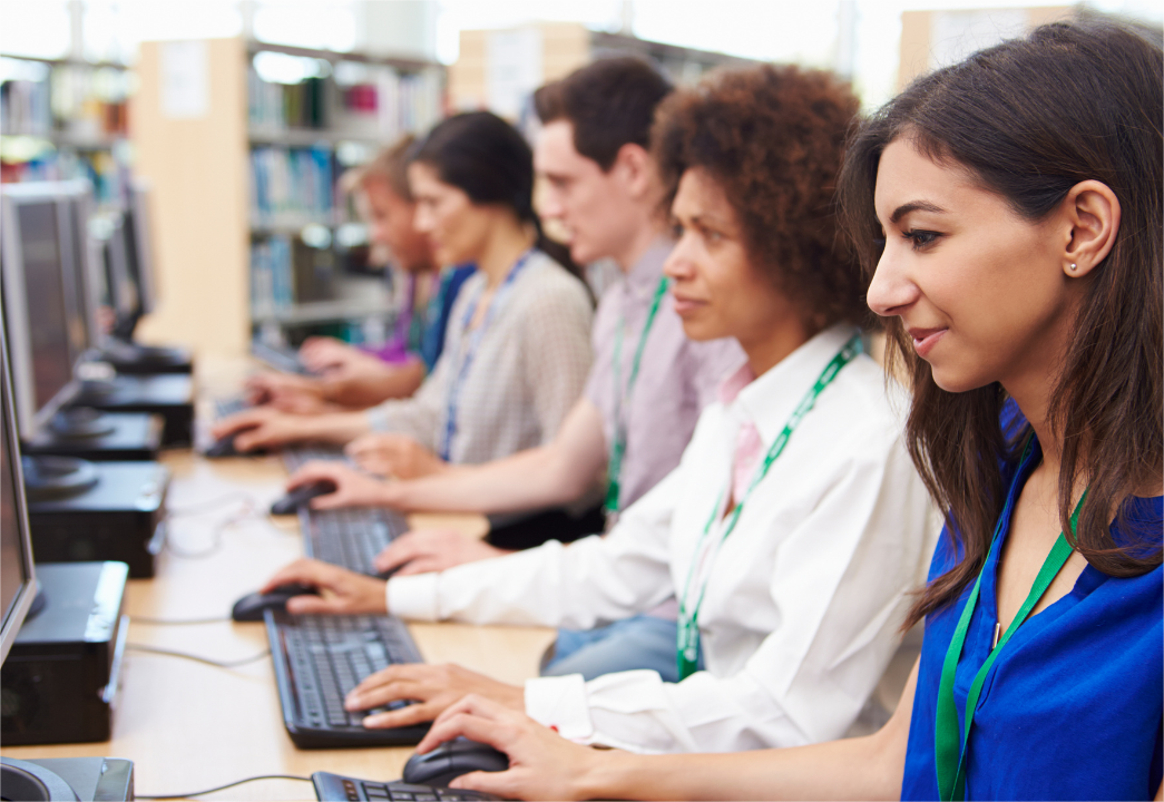 A group of students are taking a computer science class on a school trip.