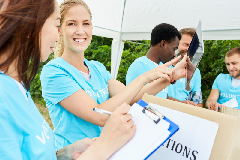 Volunteers are organizing their fundraising games.