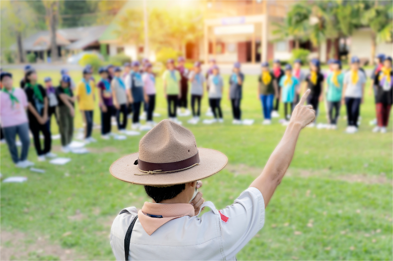 The Scout Directors is teaching activities in the middle of the Eagle Scouts.