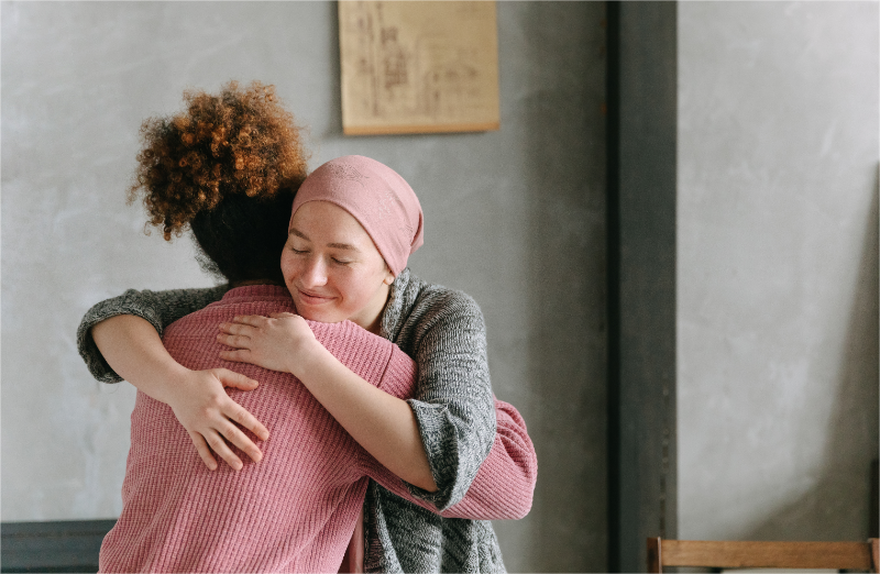 A female cares about her cancer friend.