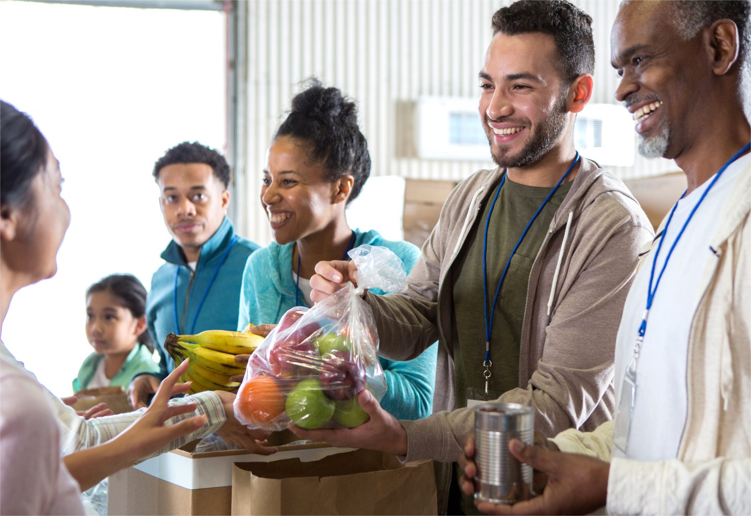 Staff from a nonprofit are distributing food to people in need.
